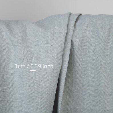 Grüngraues Halbleinen in Fischgratbindung vorgewaschen