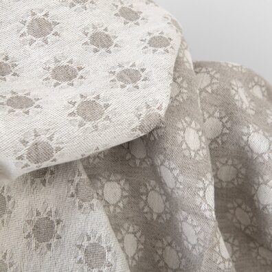 Beiges doppelseitiges Jacquard-Halbleinen mit Sonnenmuster