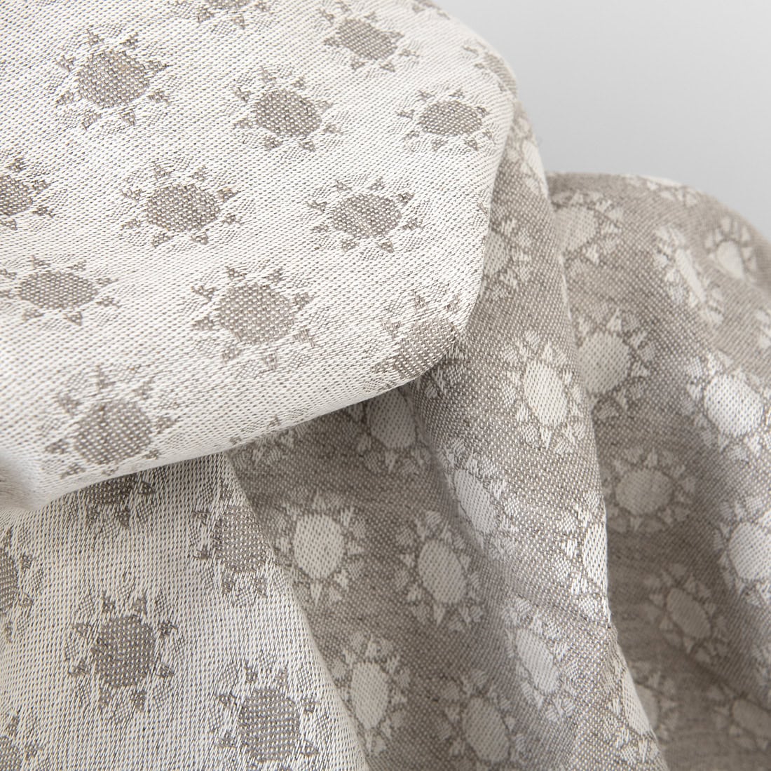 Beiges doppelseitiges Jacquard-Halbleinen mit Sonnenmuster