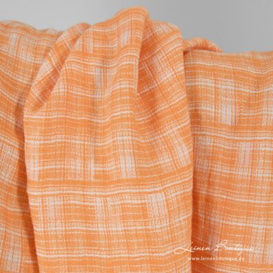 Jacquard-Reinleinen in stilisierten Karos aus orange und milchweißem Garn gewebt, speziell gewaschen